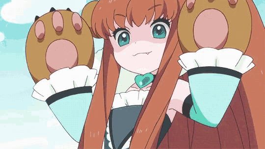 a girl with long brown hair is wearing a heart shaped pendant on her chest
