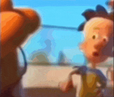 a blurry picture of a cartoon character with a blue background