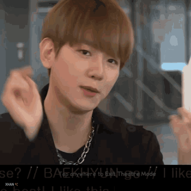 a close up of a person 's face with the words " baekhyun " written on the bottom
