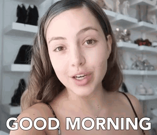 a woman says " good morning " in front of a closet full of shoes