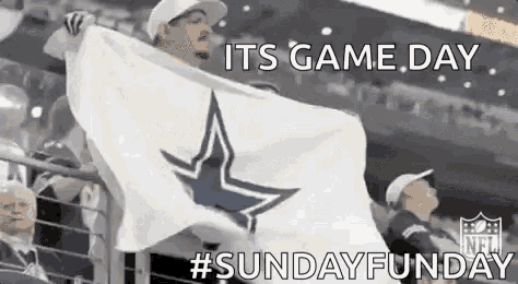 a man is holding a flag with a cowboys star on it .
