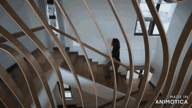 a woman is walking down a set of stairs made by animatica
