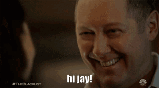 a man smiles and says hi jay in a nbc ad