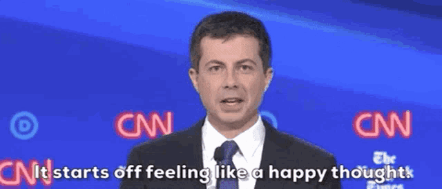 a man in a suit and tie says " it starts off feeling like a happy thought " on cnn