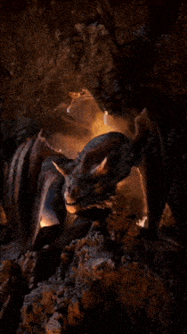 a dragon in a cave with flames coming out its mouth
