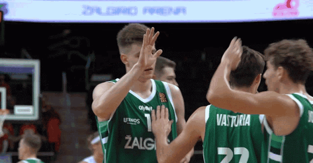 a group of basketball players one of whom has the number 27