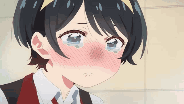 a girl with tears running down her face is wearing a red vest and tie