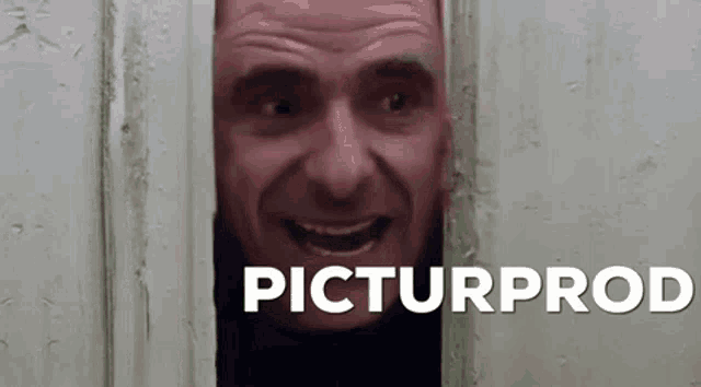 a man is peeking out from behind a door with the words picturprod written on the bottom of the image .