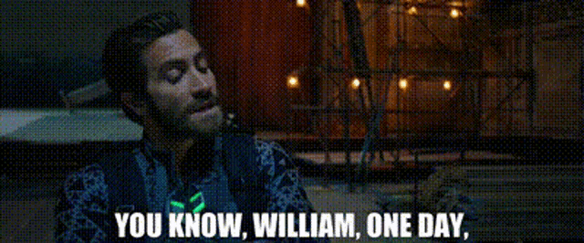 a man with a beard is sitting at a table with the words `` you know , william , one day . ''