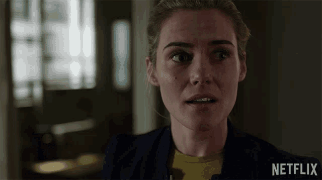 a close up of a woman 's face with netflix written on the bottom