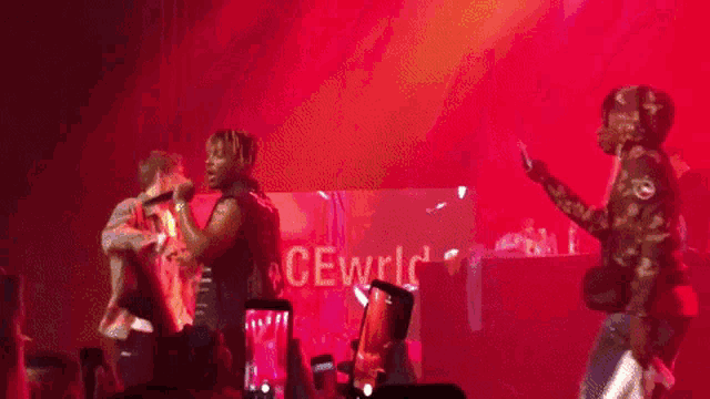 a group of people dancing on a stage with the word cewrlc behind them