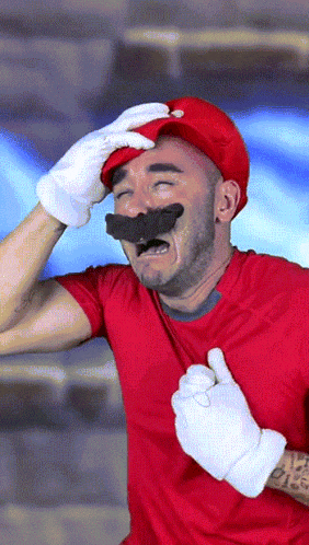 a man in a red shirt and white gloves is wearing a red hat and mustache