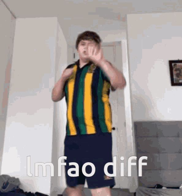 a man in a striped shirt and shorts is dancing with the words lmfao diff below him