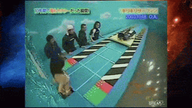 a group of people are playing a game that says break on the bottom right