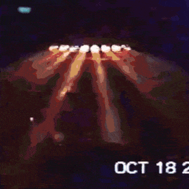 a blurred image of a person with october 18 2 on the bottom