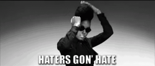 a black and white photo of a woman with the words haters gon ' hate