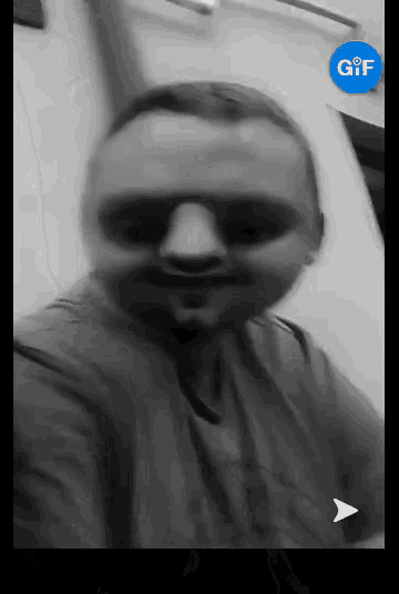 a black and white photo of a man with a blue gif icon