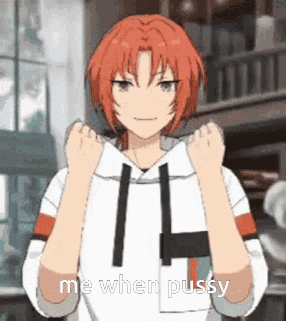 a girl with red hair is wearing a white hoodie and has her fist in the air .
