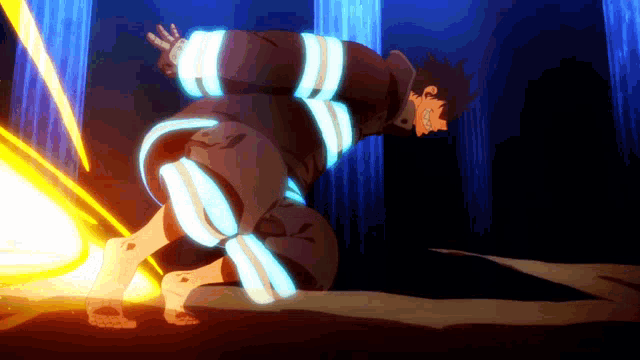 a fireman is kneeling down in a dark room with a light coming out of his legs