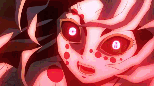 a close up of a demon slayer character with red eyes