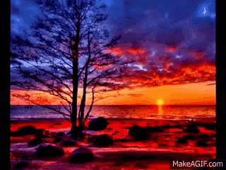 a pixel art of a sunset over the ocean with the website makeagif.com at the bottom