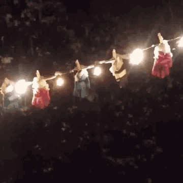 a string of lights is lit up at night