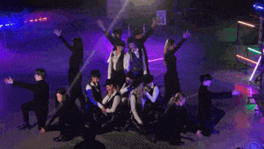 a group of people are dancing in front of a highway sign that says interstate 85