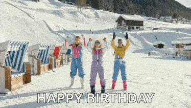 a group of people standing on a snowy mountain with the words happy birthday below them