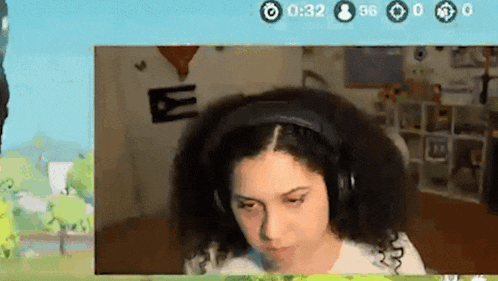 a woman wearing headphones is sitting in front of a screen that says 032