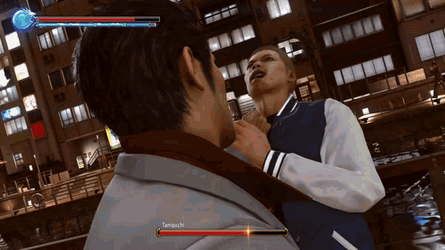 two men are fighting in a video game and one of them has a red sword