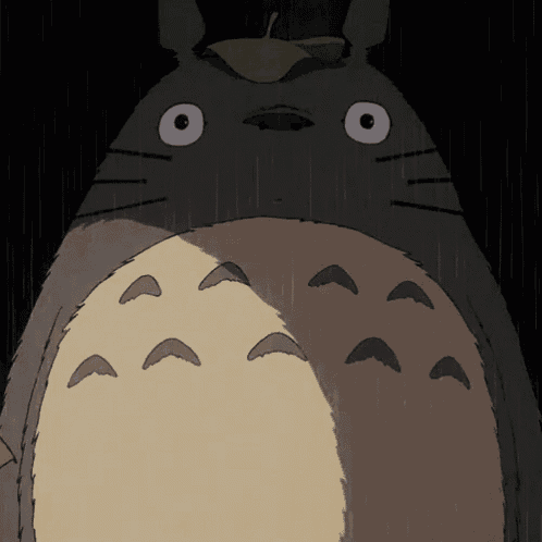 a close up of a cartoon character with a leaf on its head