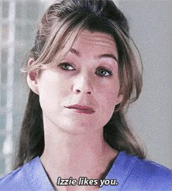 a close up of a woman 's face with the words izzie likes you