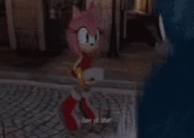 a woman in a pink dress is walking down a cobblestone street at night with a ghost in the background .