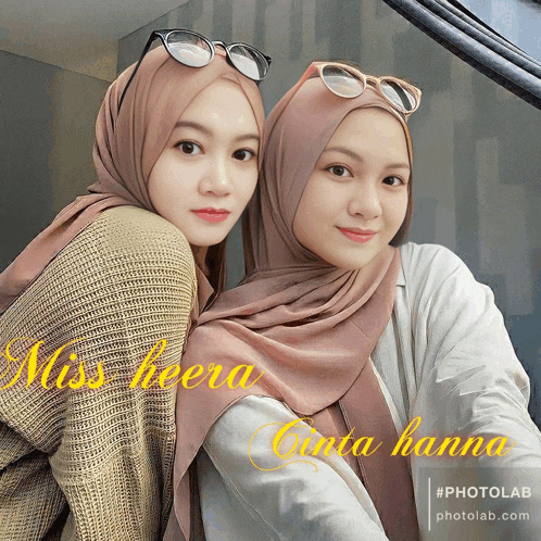 two women wearing hijabs and sunglasses are standing next to each other with the caption miss heera cinta hanna