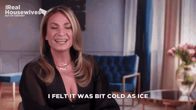 a woman sitting in a chair with the words i felt it was bit cold as ice below her