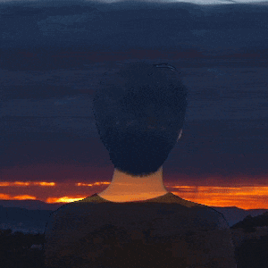 a man is looking at fireworks in the sky