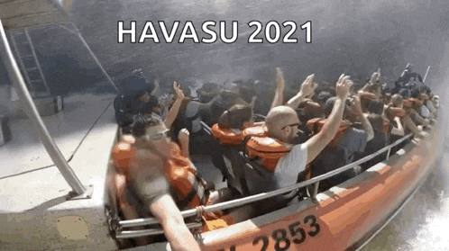 a group of people are riding a boat with the words havasu 2021 written on the side