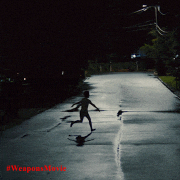 a silhouette of a person running down a street at night with #weaponsmovie written on the bottom