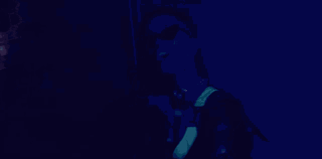 a woman wearing glow in the dark glasses and a neon top