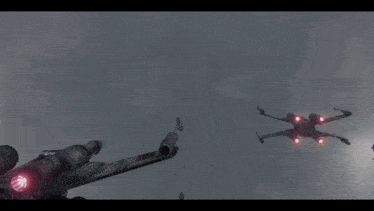 a group of x wing fighter jets flying in the sky