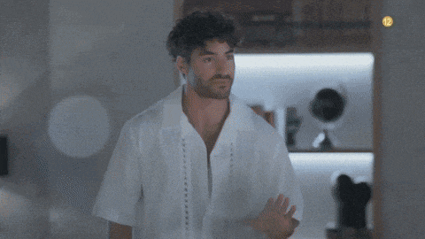 a man in a white shirt with the number 12 on the corner