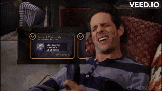a man in a striped shirt is laying on a couch with the website gifrun.com visible