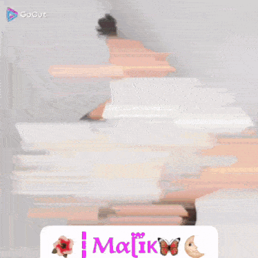 a blurry picture of a man with the name malik on the bottom