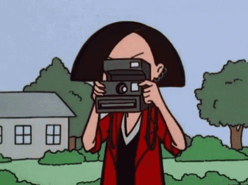 a cartoon character is taking a picture with a camera .