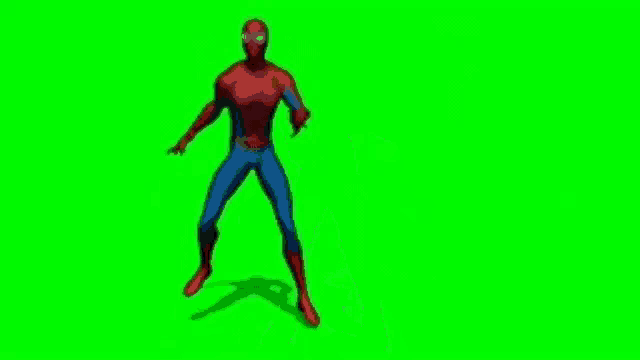 a spider-man is standing on a green screen .