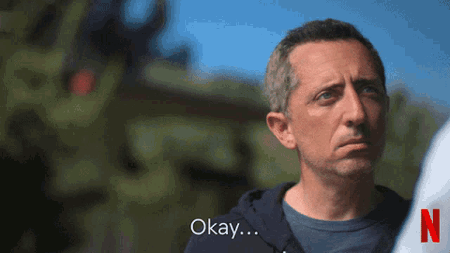 a man in a blue shirt says okay in a netflix ad