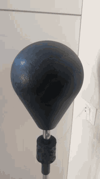 a close up of a black object with a metal handle