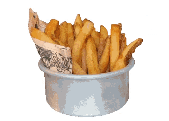 a bowl of french fries wrapped in newspaper on a table .
