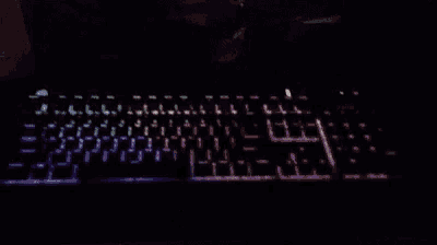 a rainbow colored keyboard with the letters l and j visible