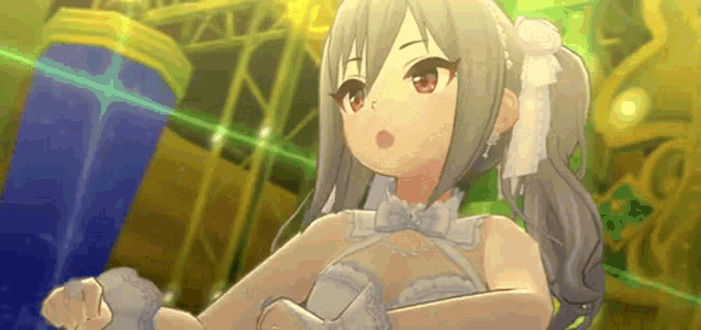 a girl in a white dress is standing in front of a stage .